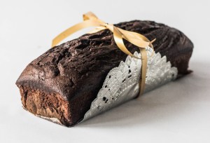 Brainstorm good gift ideas to make yourself, like this baked good wrapped in a bow